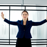 A professional individual, fully clothed in a modest business casual outfit, stands confidently with arms slightly raised, appearing to push through an invisible, shimmering barrier. The space behind the barrier is dimly lit and indistinct, symbolizing past limitations, while the area beyond it is bathed in clear, bright light, representing new possibilities and expansive growth. The composition emphasizes strength, clarity, and an optimistic outlook. Perfect anatomy, correct proportions, natural pose, well-formed hands, proper finger count, natural body proportions, professional photography, high quality, safe for work, appropriate content, fully clothed, professional.